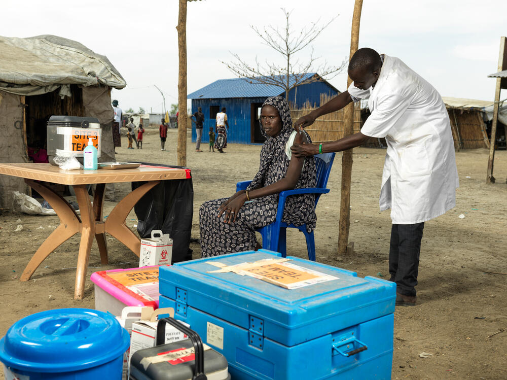 Nyekhan Gai Ghatchang, whose mother suffered badly from hepatitis E, is vaccinated against the virus in Bentiu Camp