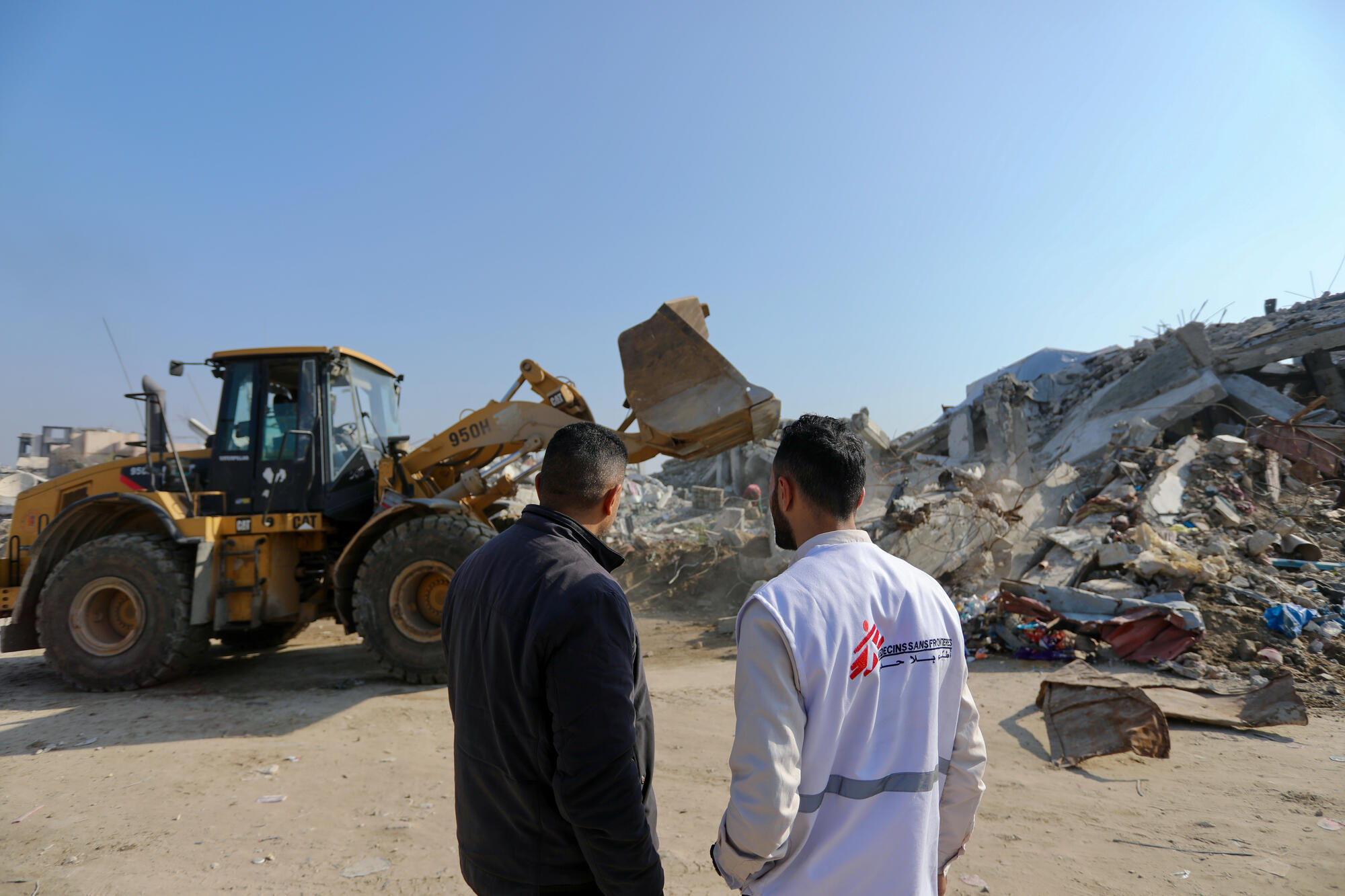 Removing rubble from a damaged clinic