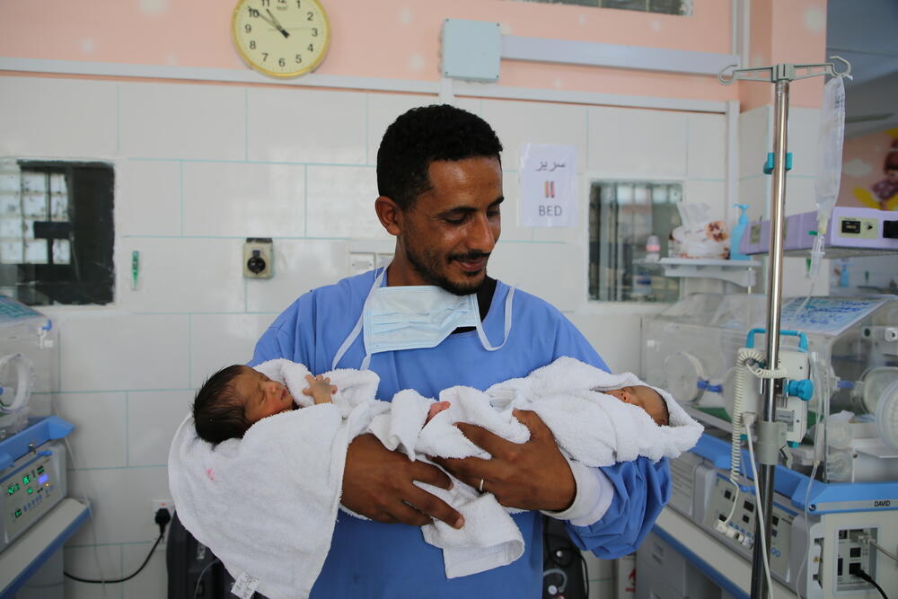 Happy father Wael Abdul Jabbar Mahyub holds his twin daughters, Heba and Malath, who are being treated at an MSF hospital in Tai Happy father Wael Abdul Jabbar Mahyub holds his twin daughters, Heba and Malath, who are being treated at an MSF hospital in Taiz City, Yemen
