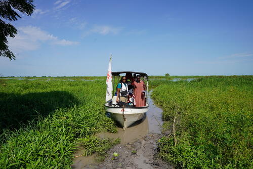 MSF outreach team traveling by boat to a remote village MSF outreach team traveling by boat to a remote village