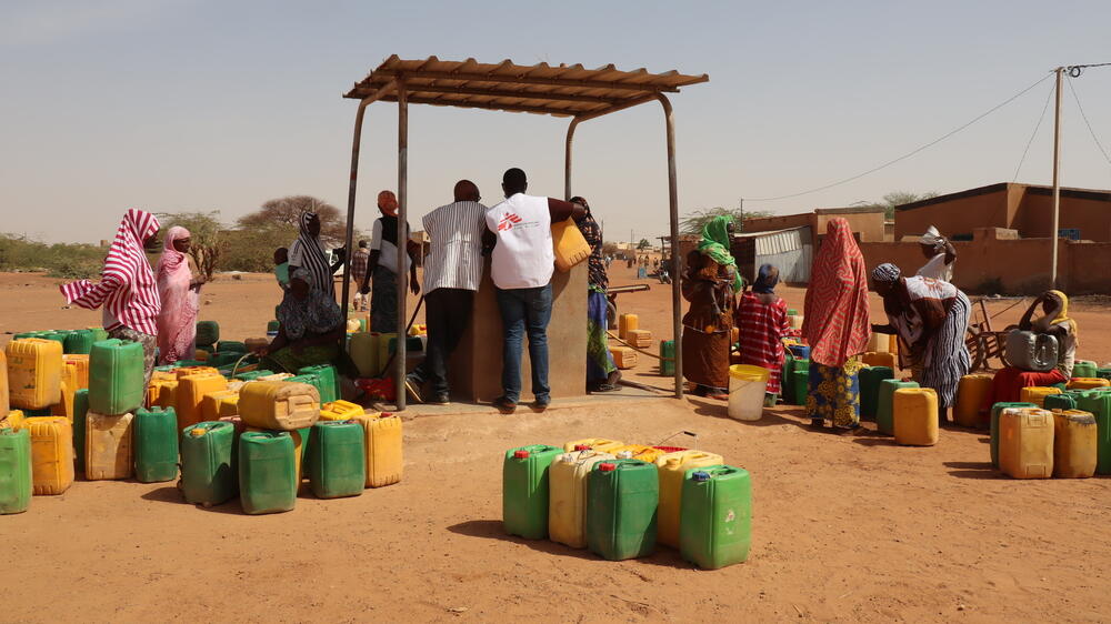 MSF staff at a water point in Gorom Gorom town, in the Sahel region of Burkina Faso