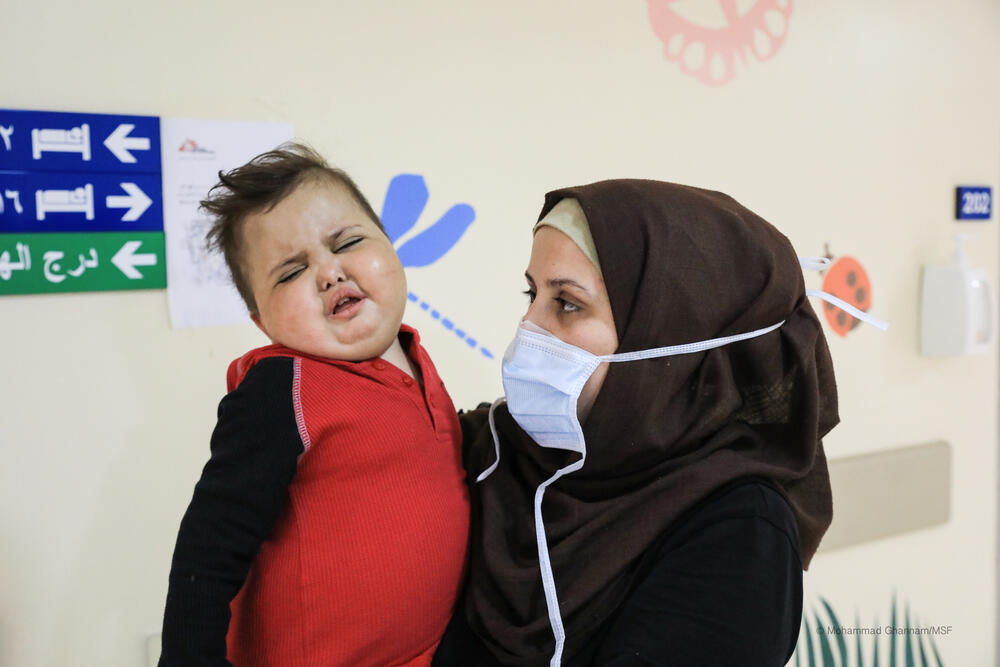 Two-and-a-half-year-old Mohammad Nour with his mother Amira.