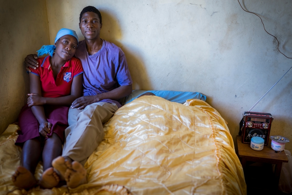 Portrait of Ngonidzashe (28) and her husband, Hastings, at home. They are an HIV positive couple supporting each other through antiretroviral treatment. They also have three healthy children. 