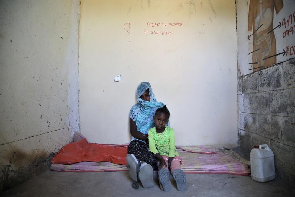 Leterbrahn lies with her five-year-old daughter in a small room where around 20 people sleep at the elementary school in Abi Adi, a town in central Tigray. 