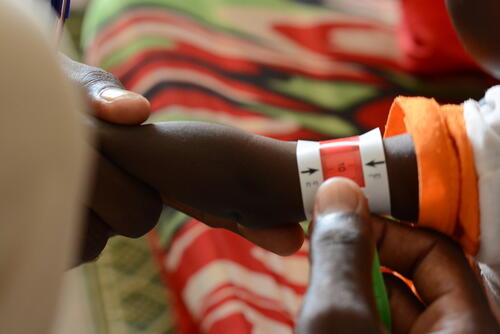 A child undergoes a malnutrition screening in at the MSF clinic in Zamzam Camp, North Darfur.