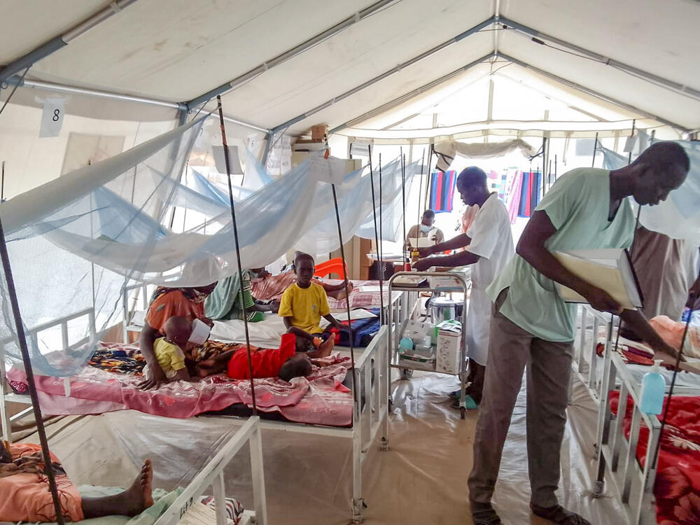 Sudanese refugees inside an MSF medical tent in Camp Ecole, Adré