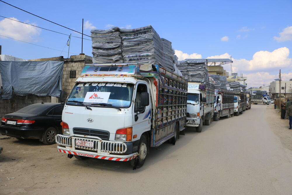 MSF-chartered trucks delivering emergency supplies from Atmeh Hospital to sites in northwest Syria