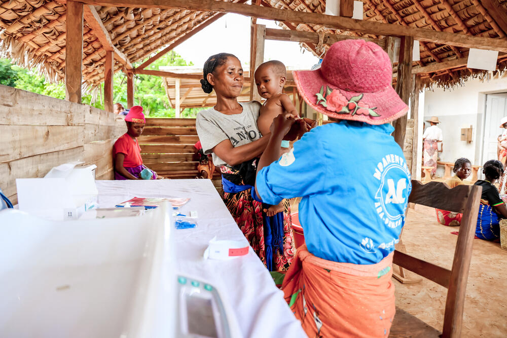 At an MSF-supported clinic in Ambodirian'i, a healthcare worker checks children for signs of malnutrition and malaria