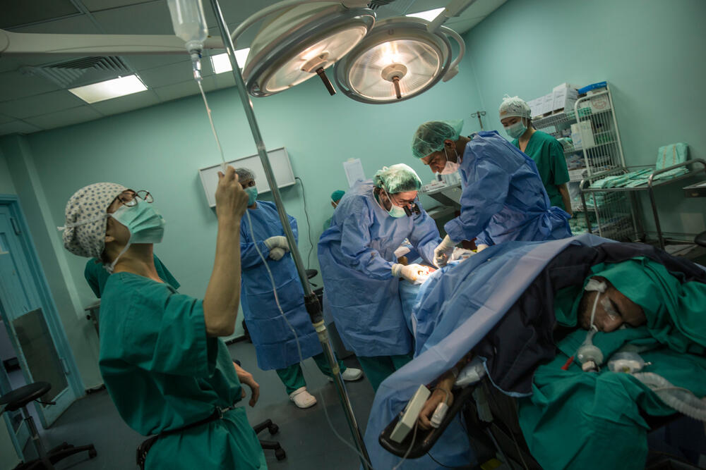 An MSF team operate on a man in Shifa Hospital, Gaza City, where Erin worked on her recent assignment. Picture taken June 2018. 