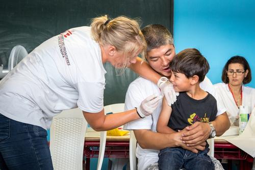 A young boy receiving vaccine A young boy receiving vaccine