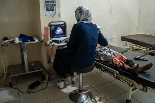 In the Darfur region, an ultrasound technician examines a pregnant woman at an MSF maternity ward (photo taken February 2024)