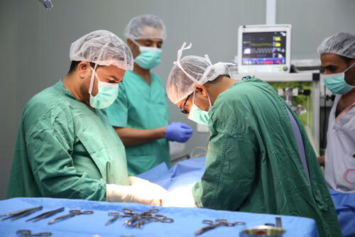 MSF team conducting an emergency surgery at the operating theatre of Abs Hospital in Hajjah.