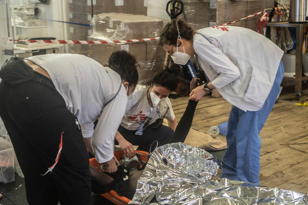 MSF medical staff treating survivors after a traumatic time at sea
