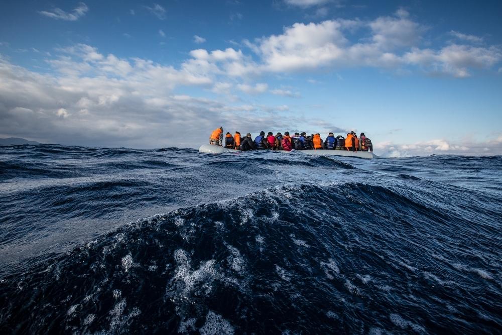 An MSF and Greenpeace rescue team respond to a sinking rigid inflatable boat carrying 45 Afghan refugees crossing from Turkey to the north shore of Lesvos, Greece. 2015.