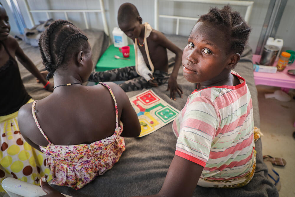 Patients play a board game in the post-operation ward at Agok hospital, where MSF treats snakebite victims. 