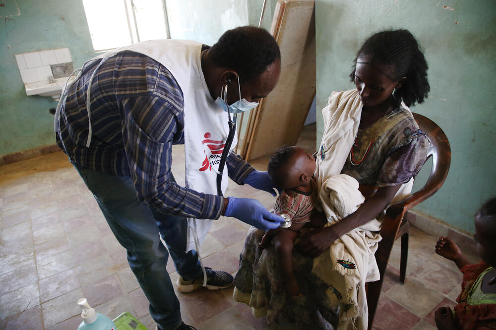An MSF medic examines a child during a mobile clinic in the village of Adiftaw, in the northern Ethiopian region of Tigray.