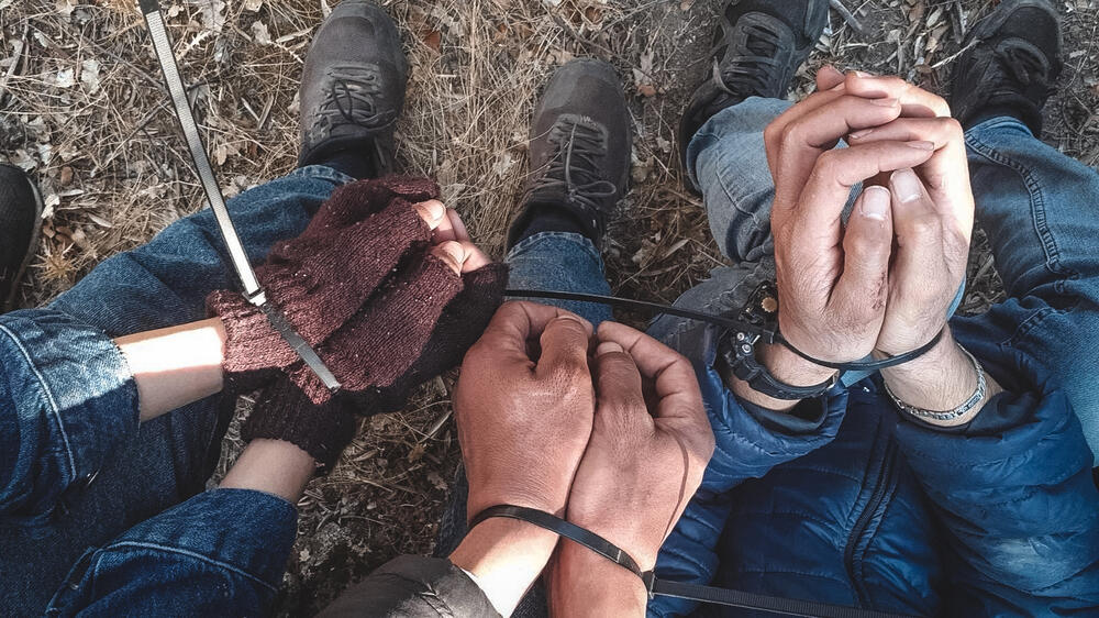 Three people found handcuffed during an MSF emergency medical intervention on the Greek island of Lesvos (October 2022)