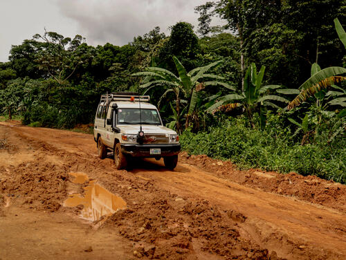 MSF van drives through mud carrying staff