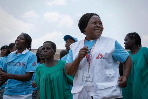 MSF and Ministry of Health and Child Care staff dance with patients at Mental Heath Commemoration Day ceremony in Harare, Zimbabwe
