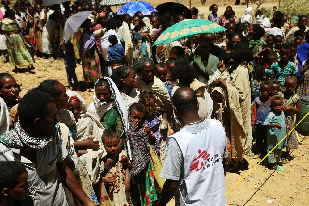 MSF translator Tedros asks people to line up to wait for medical consultations at a mobile clinic in the village of Adiftaw, in the north Ethiopian region of Tigray.