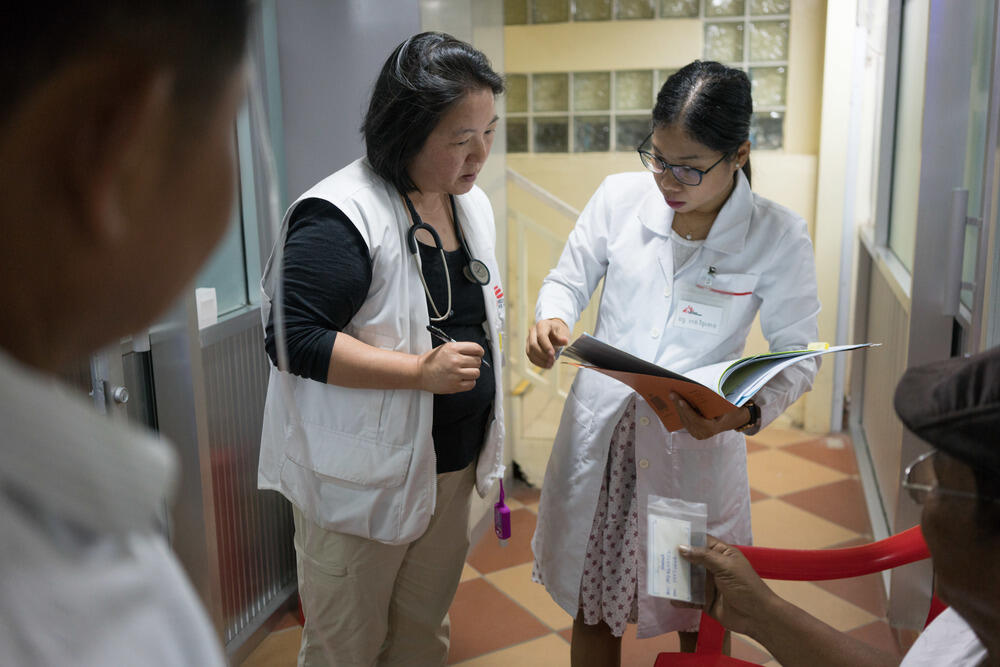 Theresa Chan discusses a patient with doctor Hang Vithuneat at the MSF Hepatitis C clinic at Preah Kossamak Hospital in Phnom Penh, Cambodia.