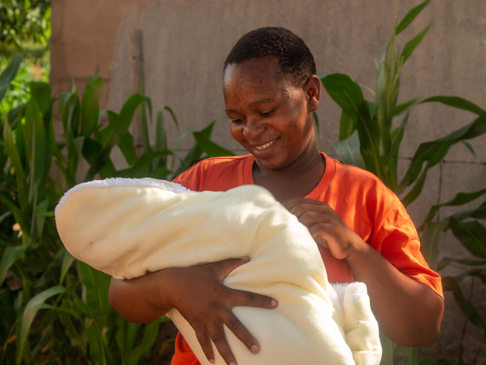Shuvai Munyaradzi holds her new baby in Gutu, Zimbabwe. Shuvai fell pregnant after successful cryotherapy to treat lesions on her cervix. 
