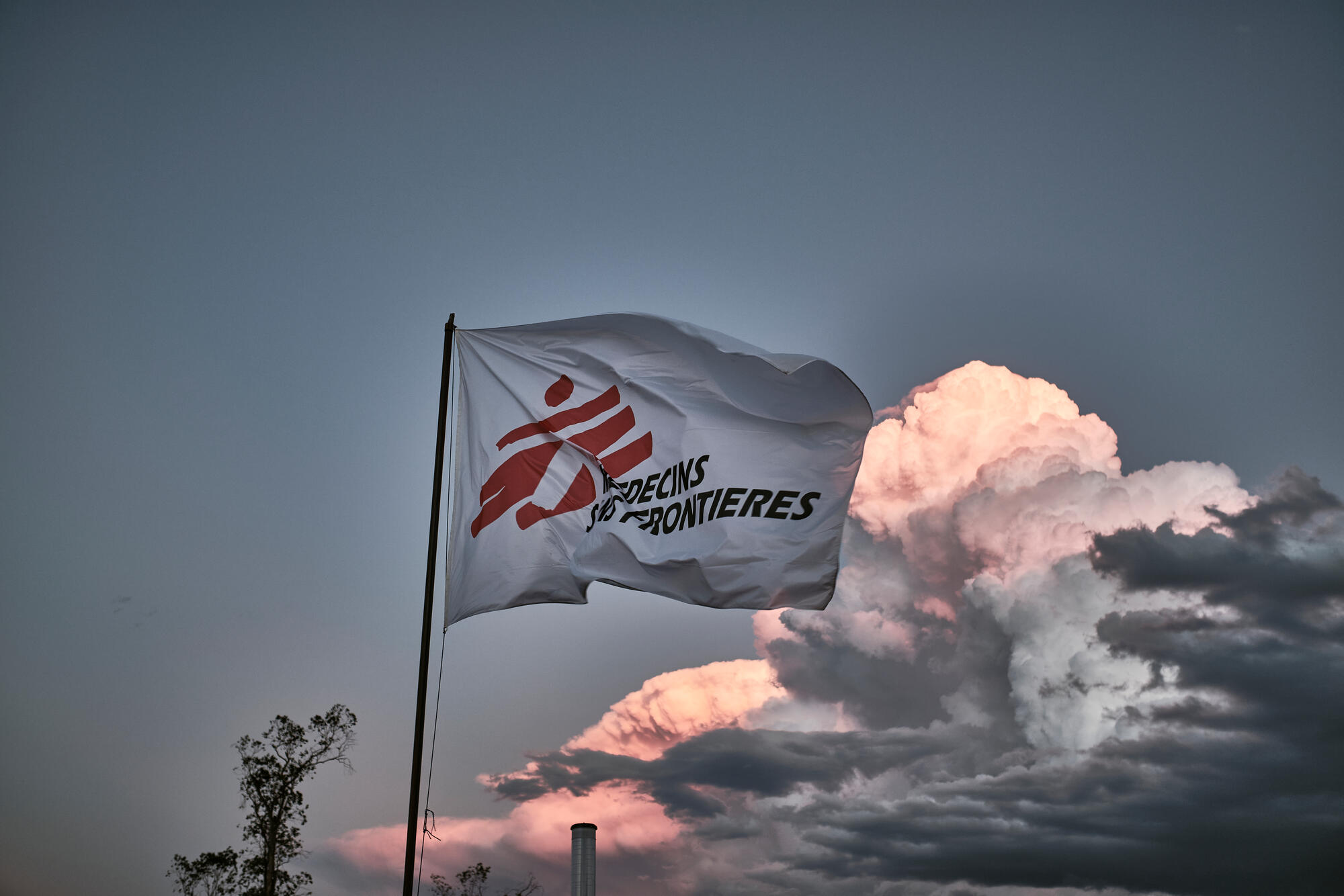 An MSF flag flies above a medical project