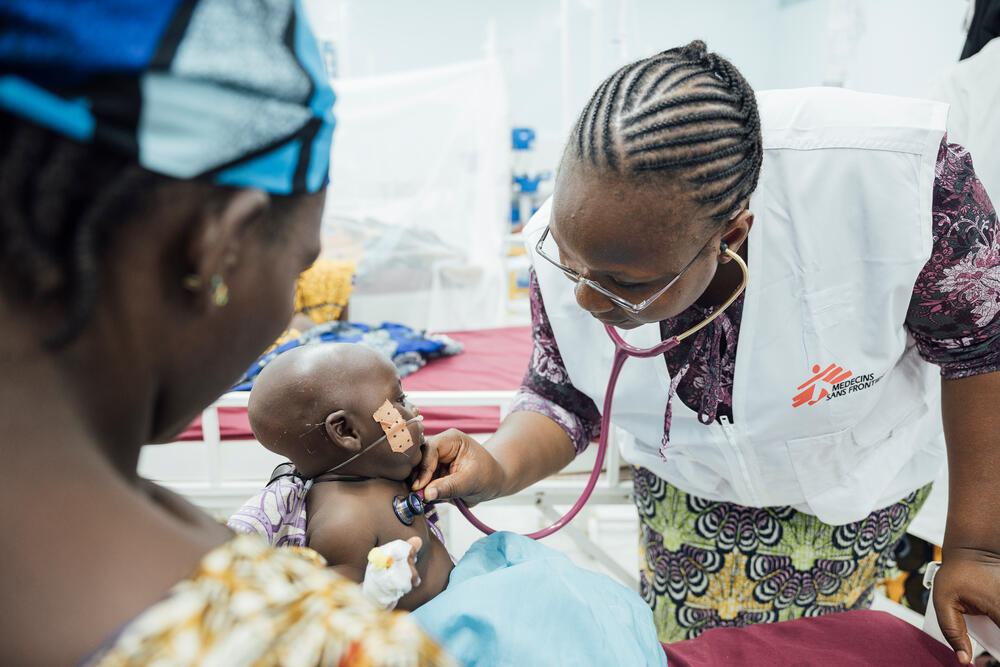 On a child malnutrition ward in Niger, MSF doctor Adiaratou Dakono checks on four-month-old Abdousalam Issa with his mother Saad On a child malnutrition ward in Niger, MSF doctor Adiaratou Dakono checks on four-month-old Abdousalam Issa with his mother Saadatou Saminoa