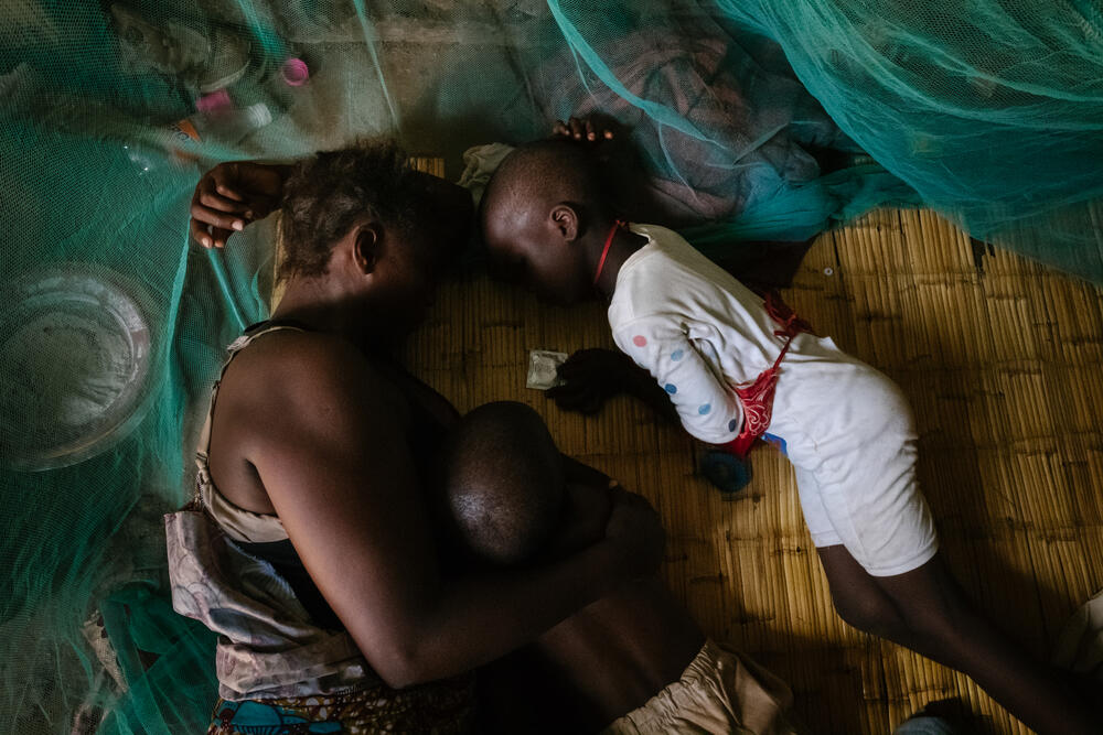 A sex worker resting with her children at a compound in Nsanje - many sex workers are often the main provider for their children.