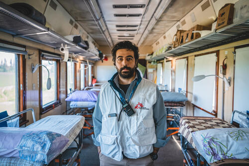 Yasser Kamaledin, the project coordinator inside the inpatient department of the MSF medical train during a journey to Pokrovsk, in eastern Ukraine, where the team pick up war wounded and sick patients, and transport them back to hospitals in western Ukraine.