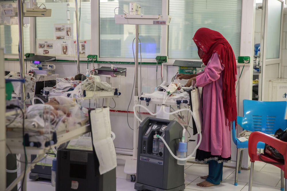 A mother feeds her baby in the neonatal ward at MSF's Khost Maternity Hospital