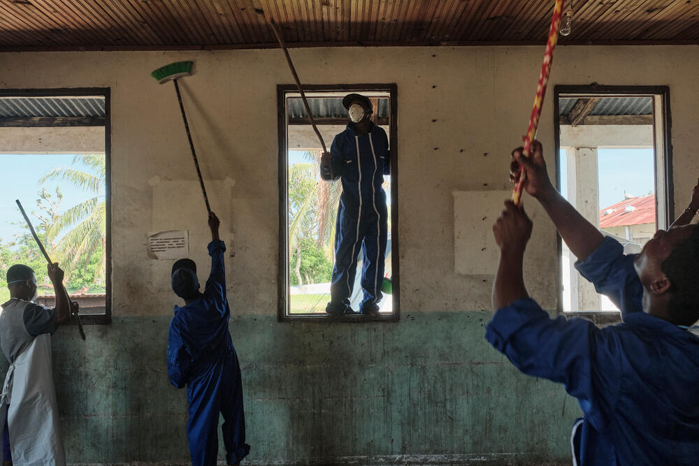 A partially destroyed hospital ward being cleaned and rehabilitated in Nosy Varika