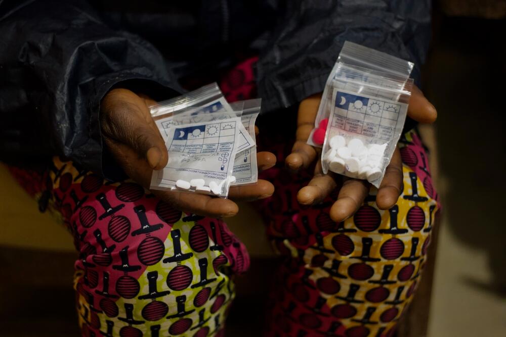 A patient holds the drugs she has just been given to proceed with a termination of pregnancy at Kusisa hospital, North Kivu