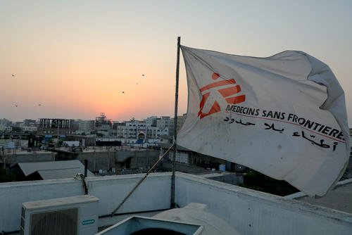 MSF flag over the top of the hospital