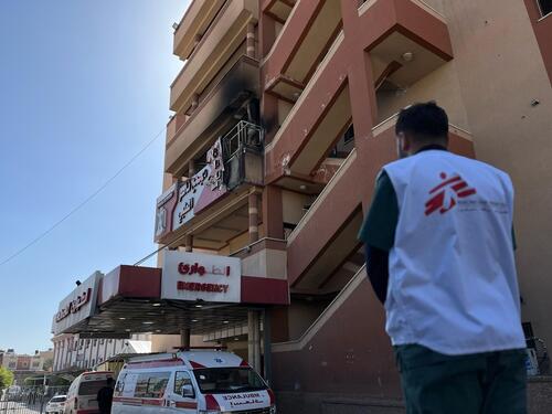 An MSF staff member assesses damage to Nasser Hospital, following an Israeli strike on 23 March