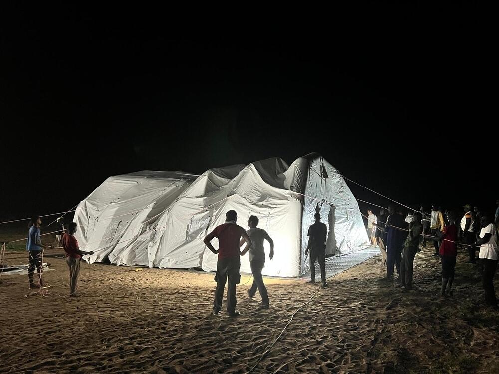 MSF teams work around the clock to set up an inflatable hospital to treat Sudanese refugees arriving in Chad