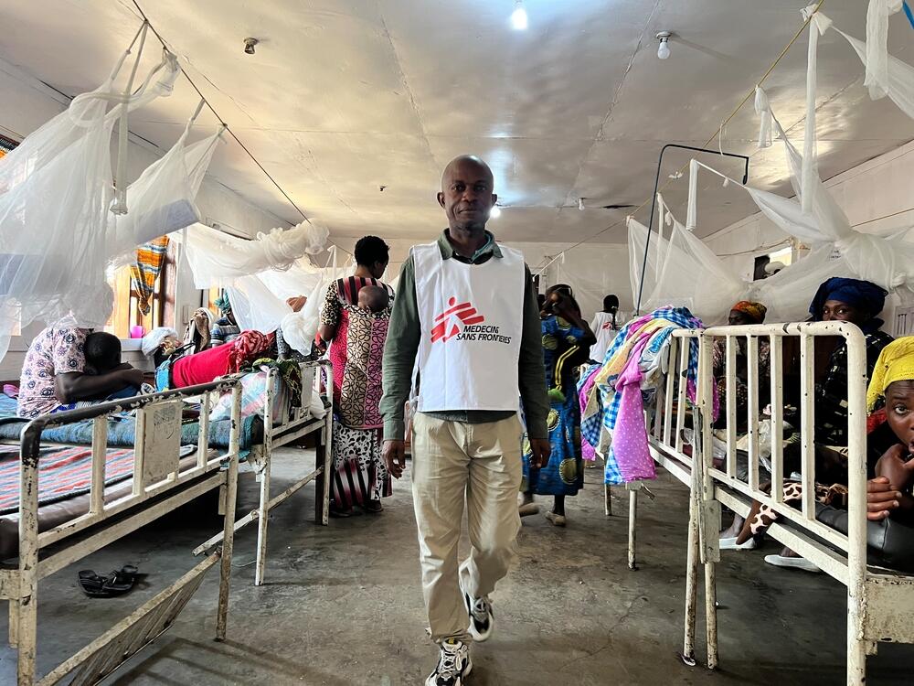An MSF staff member walks through a ward full of patients at the Minova General Referral Hospital, in South Kivu, DRC