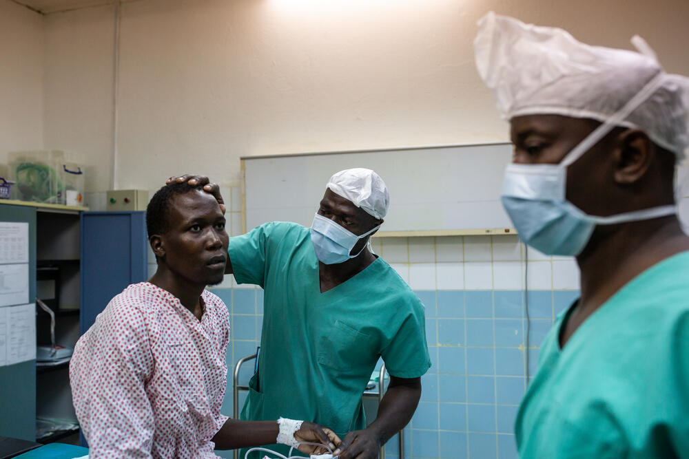 Madi Assewe, a patient, sits in the operating theatre at Maroua General Hospital
