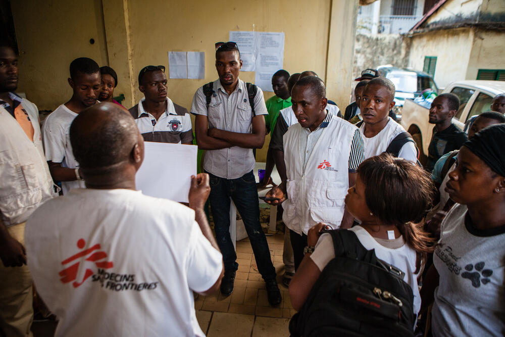 MSF staff discuss logistics during our mass measles vaccination campaign in Conakry, Guinea.
