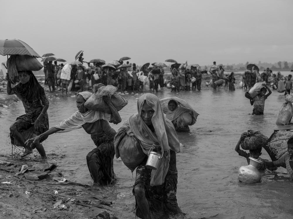 Rohingya refugees flee brutal violence in Myanmar, crossing the Naf River towards the refugee camps in Cox's Bazar, Bangladesh, October 2017.