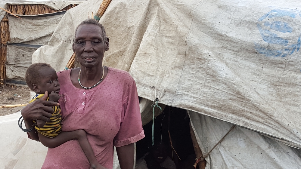 Nantiek hold her young granddaughter in the PoC Camp in Bentiu, South Sudan.