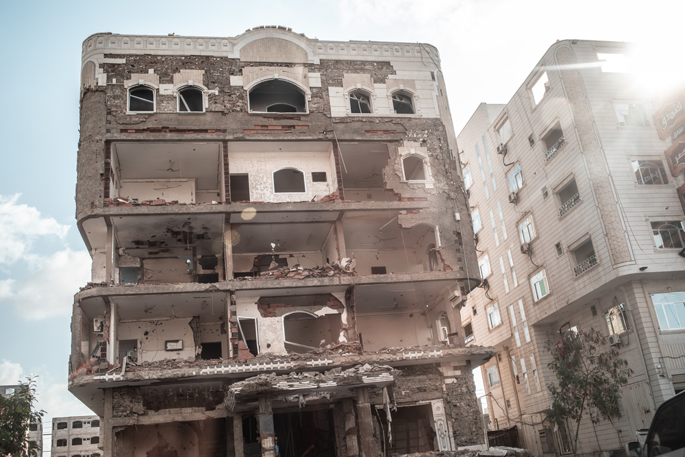 A building destroyed by fighting in the city of Aden, Yemen