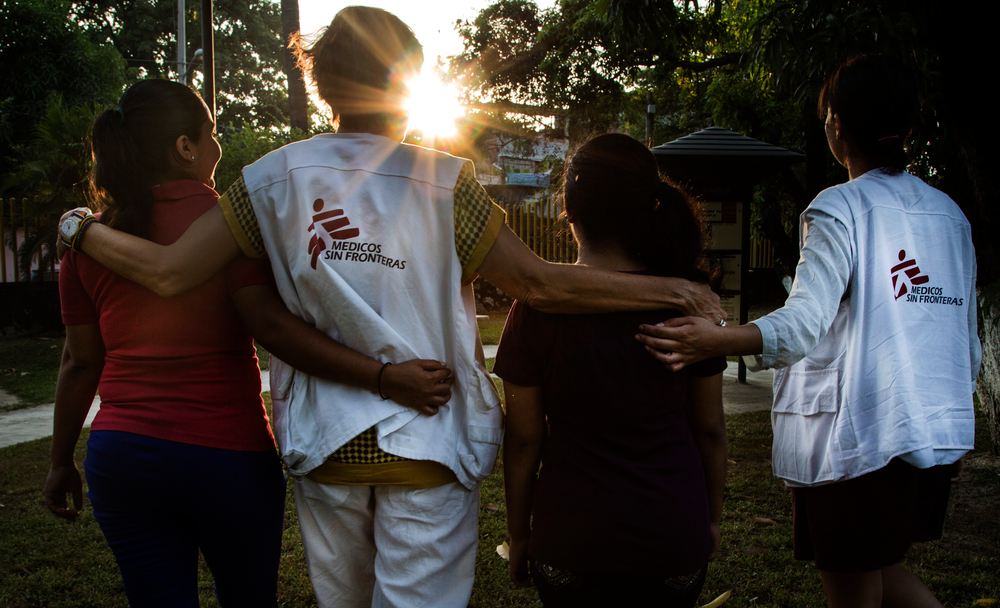 Two Doctors Without Borders social psychologists take a walk with two patients.